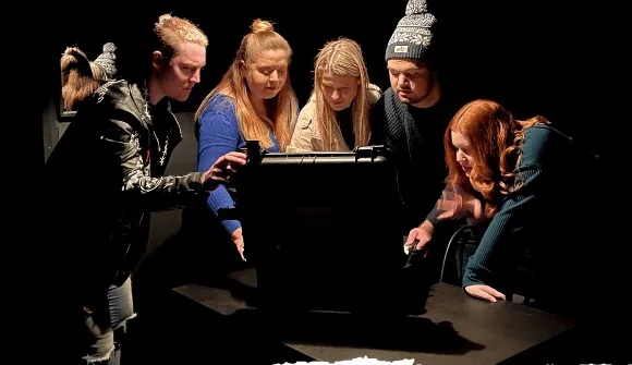 Players huddled around the case in the original President's Briefcase game, the room that became The President's Bunker